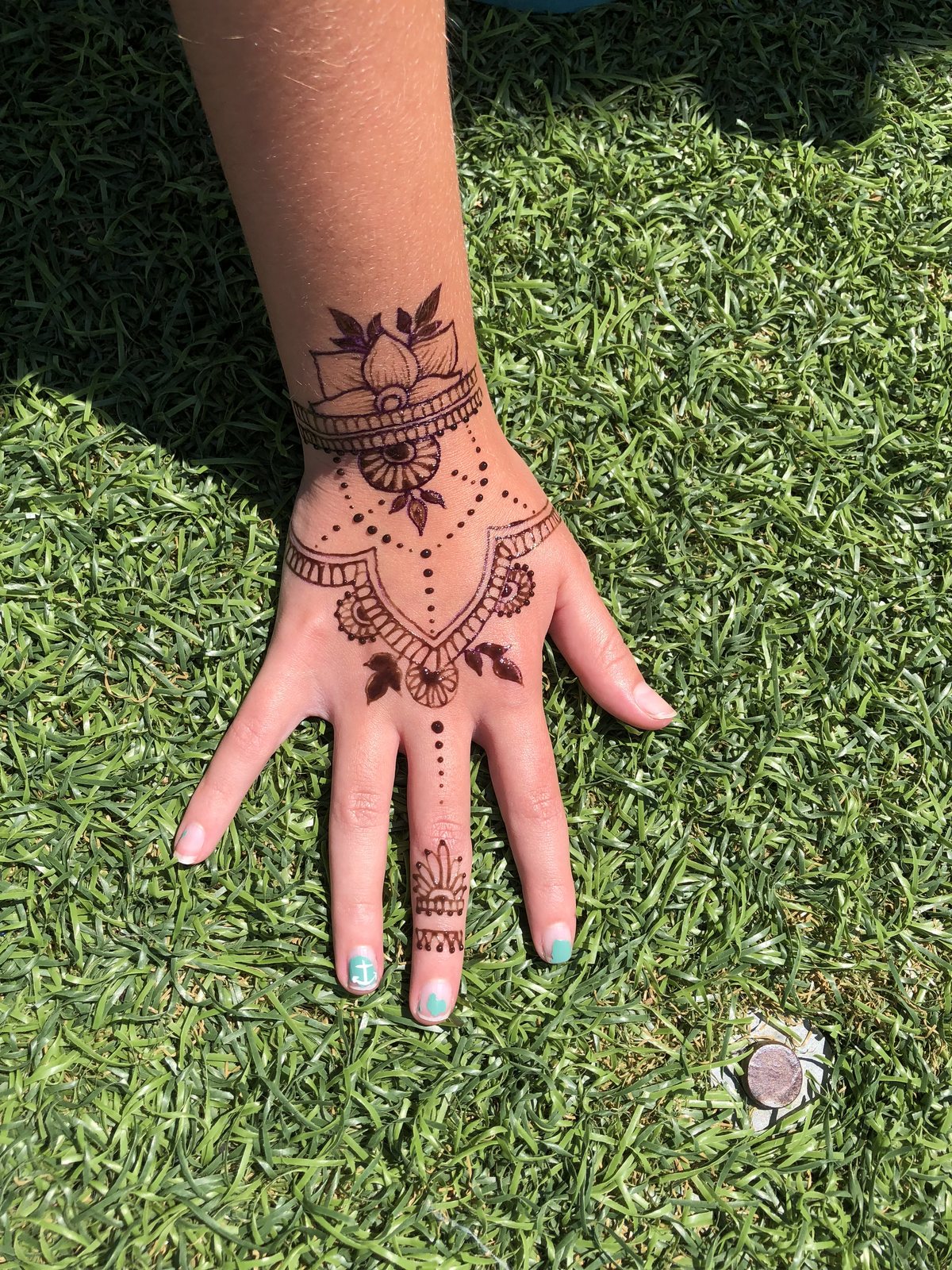 A bold henna design photographed in the Cape Cod sunshine