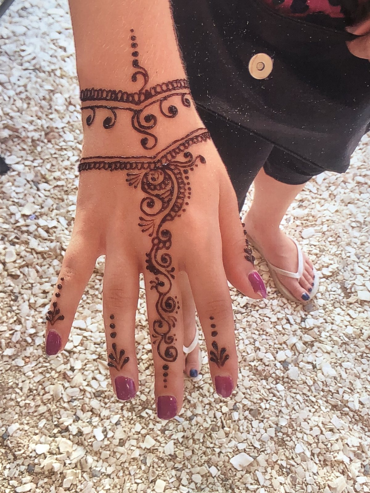 Fresh henna artwork ready for a vacation photo